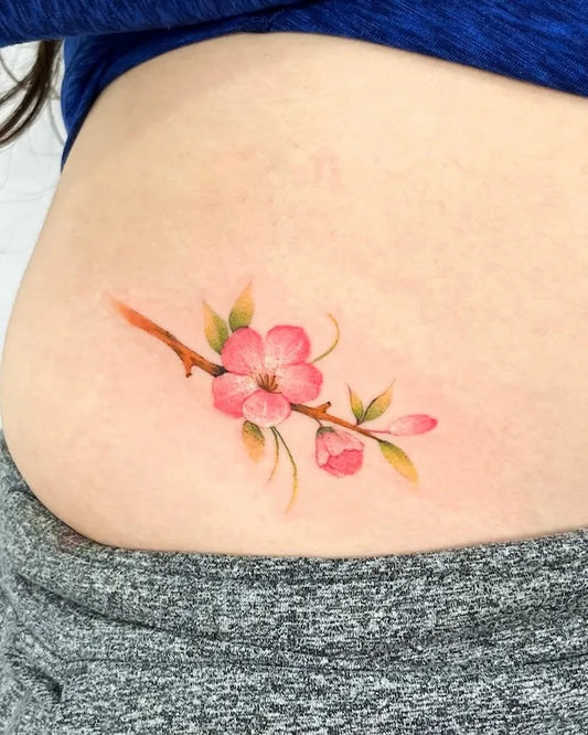 color cherry blossom tattoo on woman stomach