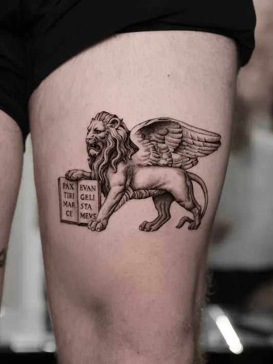 black and grey realism lion of saint mark tattoo on thigh