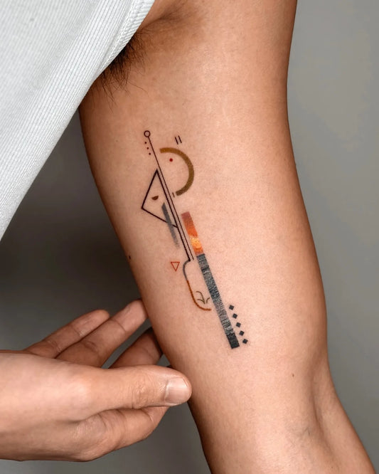 Bang Bang Basil color geometric abstract tattoo on bicep