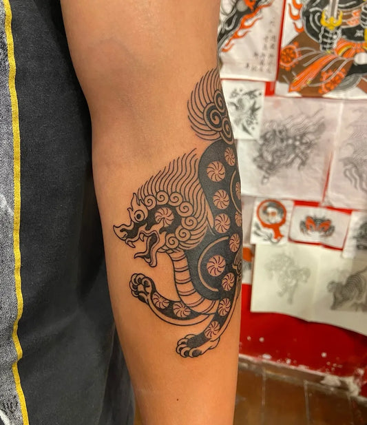 thai traditional singha tattoo on arm