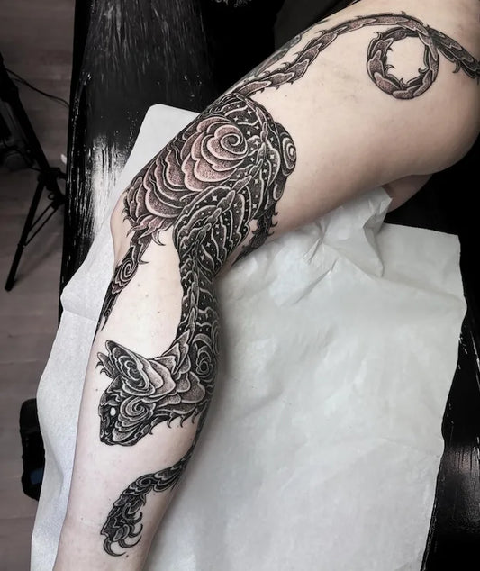 blackwork large piece star cat tattoo on woman full leg
