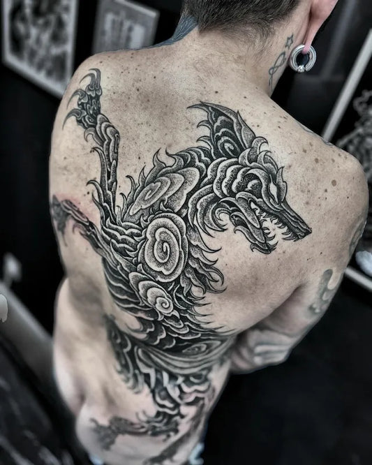 blackwork large piece dragon black and grey tattoo on man back
