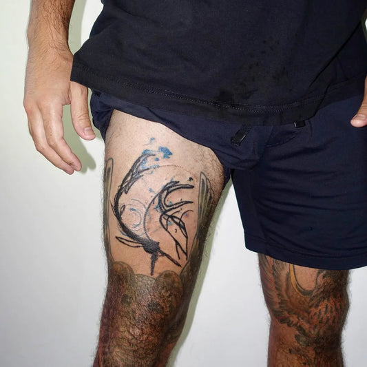 hand poke abstract man thigh tattoo