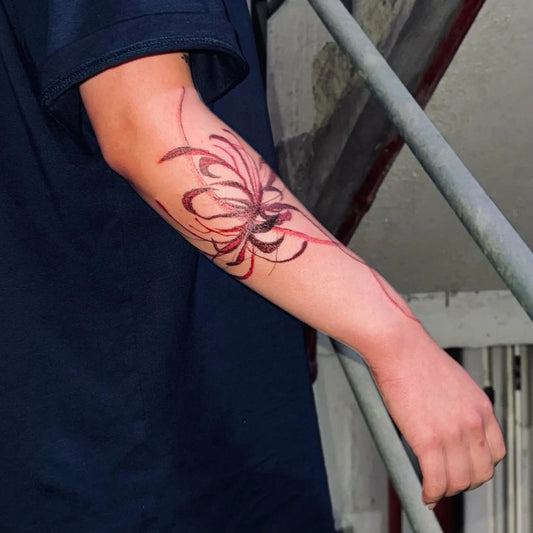 red spider lily hand poke tattoo