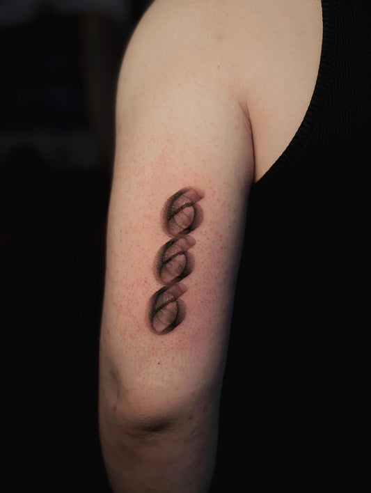 blurry 666 lettering tattoo