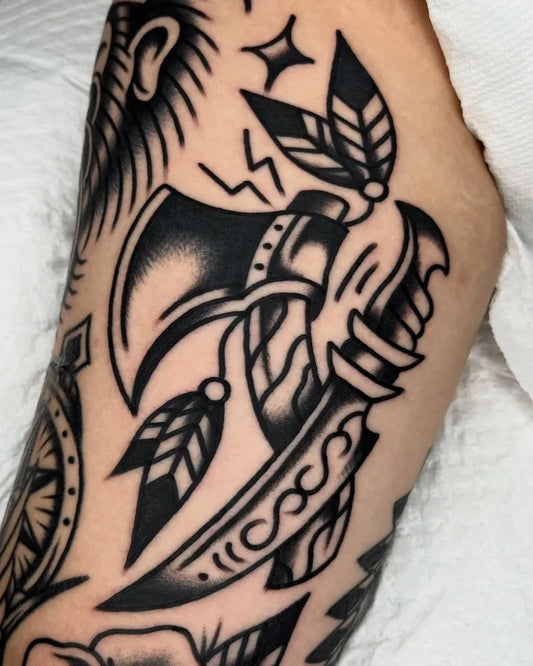 Big American Traditional Axes Dagger Feathers on Men Arm Tattoo by @allo_tattooer