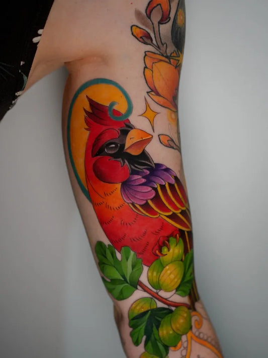 Big American Traditional Cardinal Flowers Vines Tattoo on Women Arm by @l.alisa.tattoo