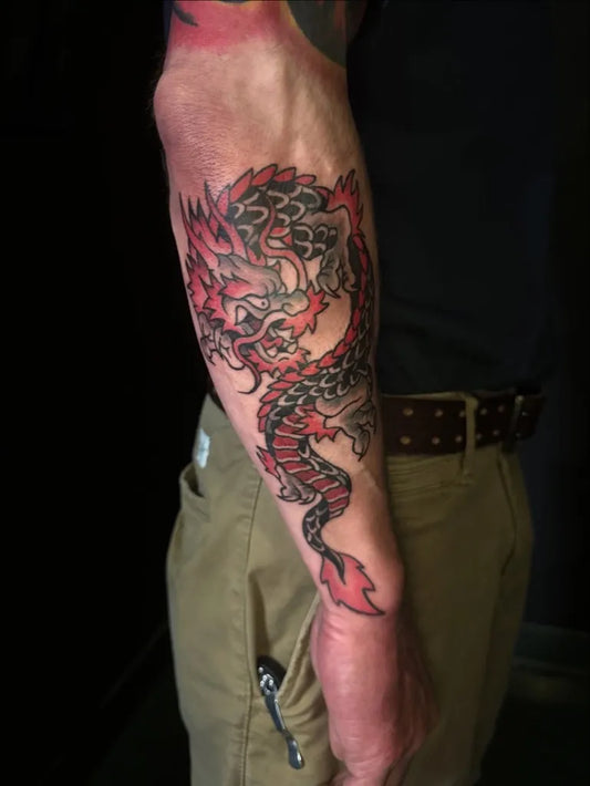 Big American Traditional Dragon on Men Arm Tattoo by @weaponix