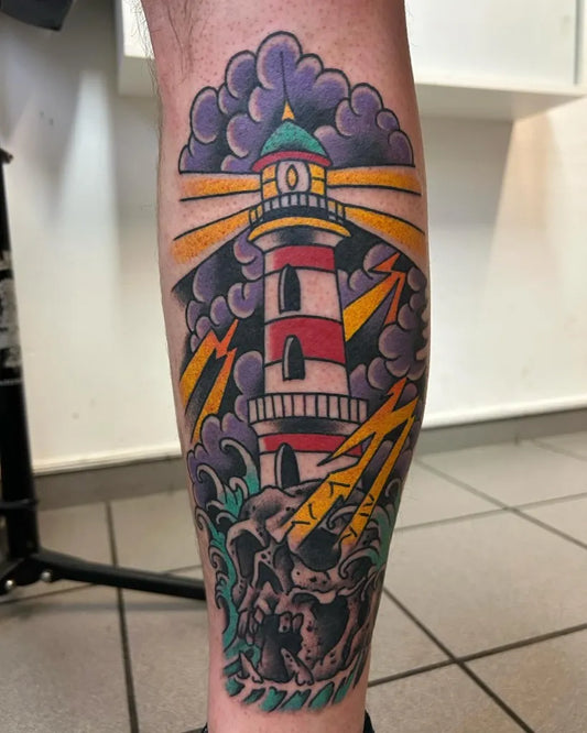 Big American Traditional Lighthouse with Storm and Skull Tattoo on Men Leg by @dirkreutertattooer