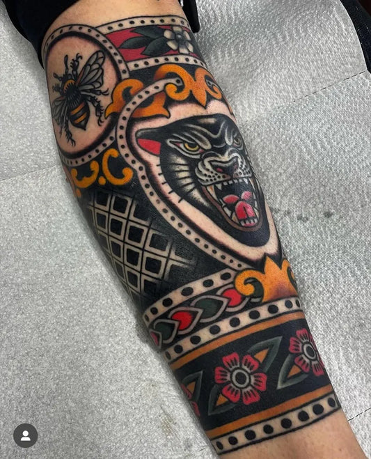 Big American Traditional Panther Bee Floral Borders on Men Forearm Tattoo by @framed_ink_