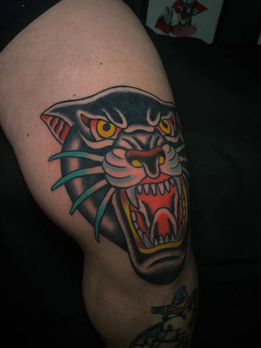 Big American Traditional Panther Tattoo on Women Knee by @eleven_serpents