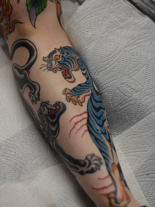 Big American Traditional Panther and Tiger Tattoo on Men Arm by @adam_medina_ruff