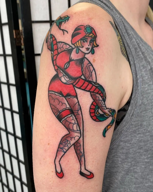 Big American Traditional Pin Up Girl with Snake and Frog Tattoo on Women Upper Arm by @ericbtattoos