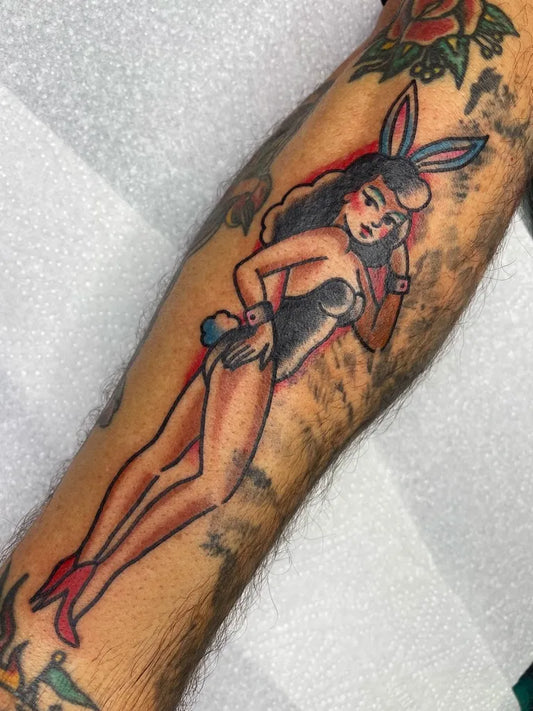 Big American Traditional Pinup Bunny Girl on Men Arm Tattoo by @jswift_tattoo
