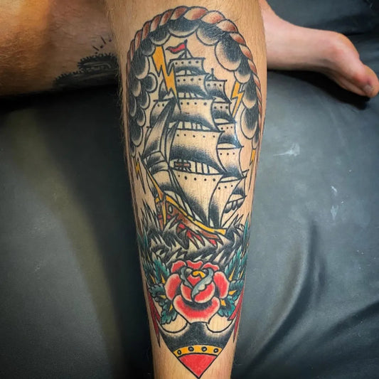 Big American Traditional Sailing Ship with Lightning and Rose Nautical Tattoo on Men Leg by @megmcniel