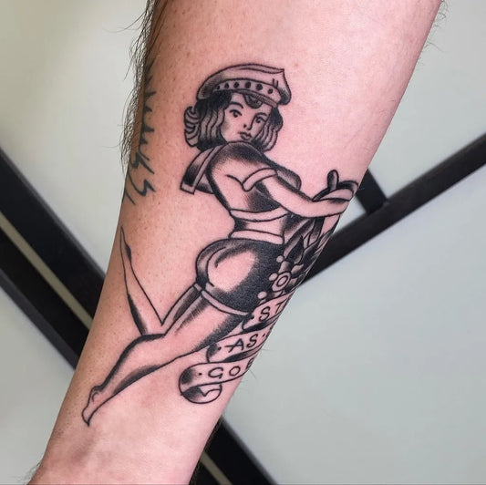 Big American Traditional Sailor Girl on Anchor on Men Arm Tattoo by @justin.adams.tattoo