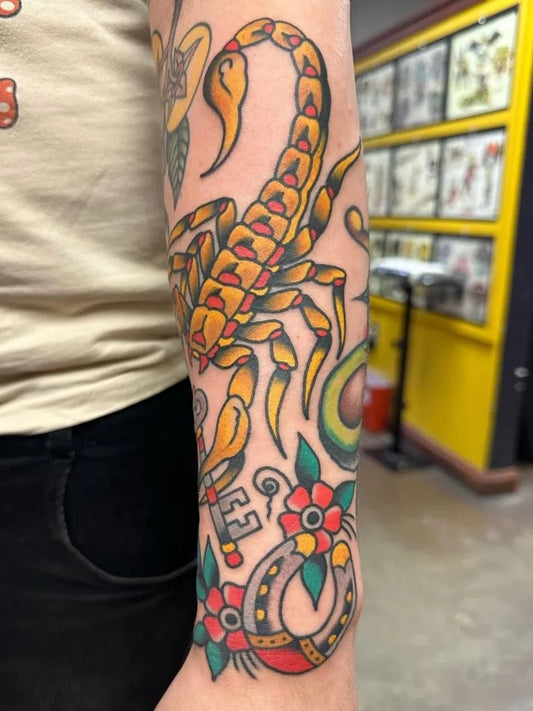 Big American Traditional Scorpion with Flowers and Horseshoe on Men Arm Tattoo by @hotstufftattoo