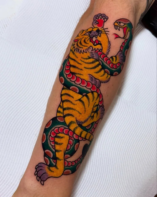 Big American Traditional Tiger Snake on Men Arm Tattoo by @gordy_evelyn_tattooer