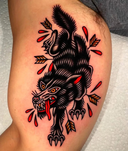 Big American Traditional Wolf with Arrows on Women Thigh Tattoo by @electricstreettattoo