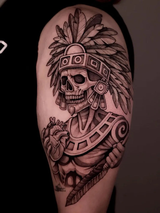 Big Aztec Sugar Skull with Feathered Headdress and Heart Men Shoulder by @wolfang.ink