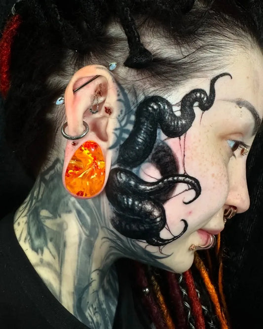 Big Black Tentacles on Women Face Tattoo by @derekdereksan