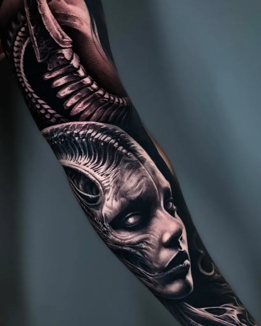 Big Black and Grey Alien Face Tattoo on Women Arm by @kreatattoo