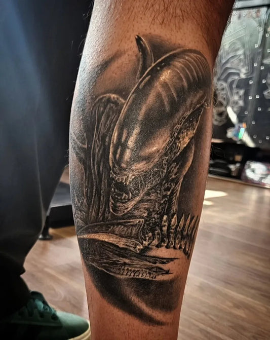 Big Black and Grey Alien Tattoo on Men Leg by @beth.sorrows