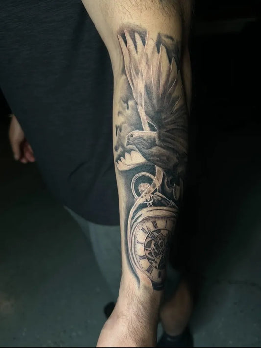 Big Black and Grey Angel Clock Tattoo on Men Arm by @zapatito.inkoperated