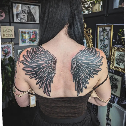 Big Black and Grey Angel Wings Tattoo on Women Back by @tattsbybree