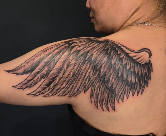 Big Black and Grey Angel Wings Tattoo on Women Shoulder by @beyondink_bangalore