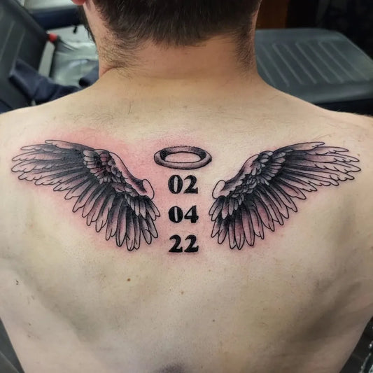 Big Black and Grey Angel Wings with Date Tattoo on Men Back by @gavinclarketattoos