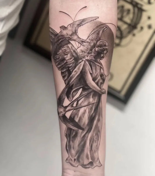 Big Black and Grey Angel and Dove Tattoo on Men Arm by @tattoospot.app