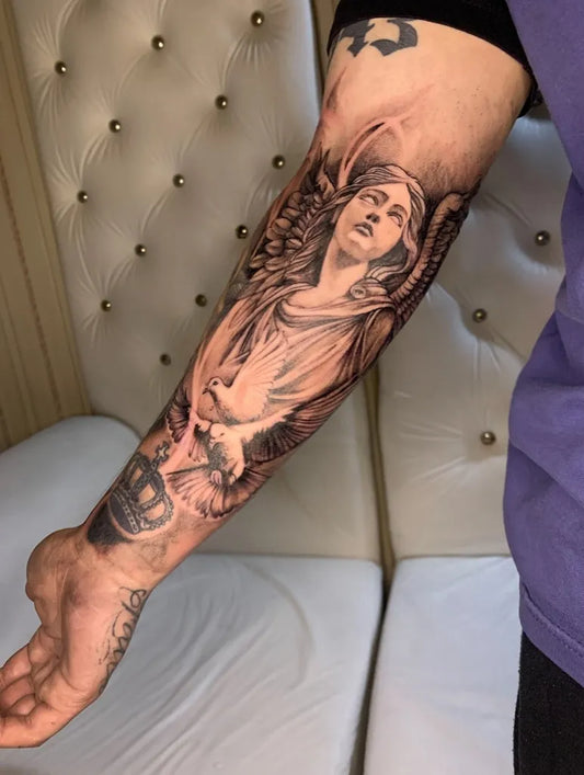 Big Black and Grey Angel with Crown on Men Arm Tattoo by @lalo.tattoos