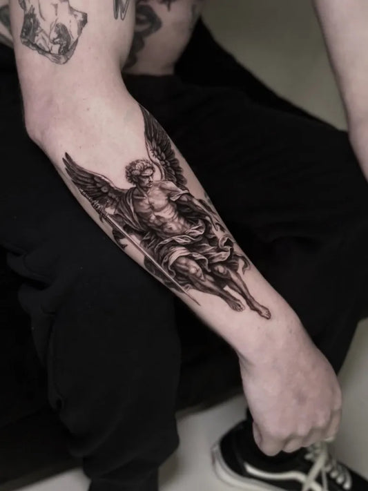 Big Black and Grey Angel with Spear and Shield on Men Arm Tattoo by @beaustanfordtattoo