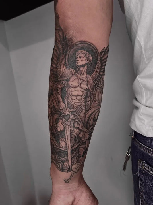 Big Black and Grey Angel with Sword on Men Arm Tattoo by @gio.rivera.fine