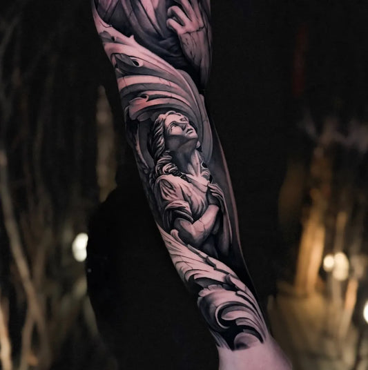 Big Black and Grey Angel with Wings and Drapery on Women Arm Tattoo by @alexnigliotattoos