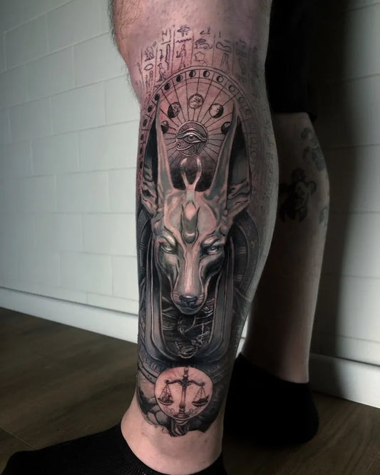 Big Black and Grey Anubis Egyptian God Tattoo on Men Leg by @simonezingaretti_tattoo