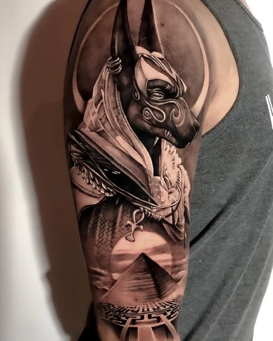 Big Black and Grey Anubis Egyptian Landscape Tattoo on Men Arm by @odiegosamuel