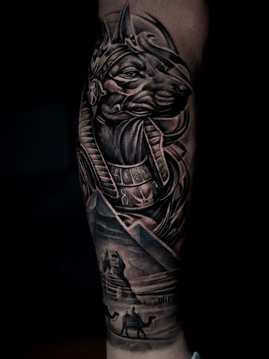 Big Black and Grey Anubis Egyptian Landscape Tattoo on Men Arm by @omart_tattoo