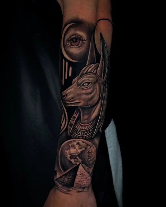 Big Black and Grey Anubis Eye of Horus Pyramid Tattoo on Men Arm by @soffink_tattoo