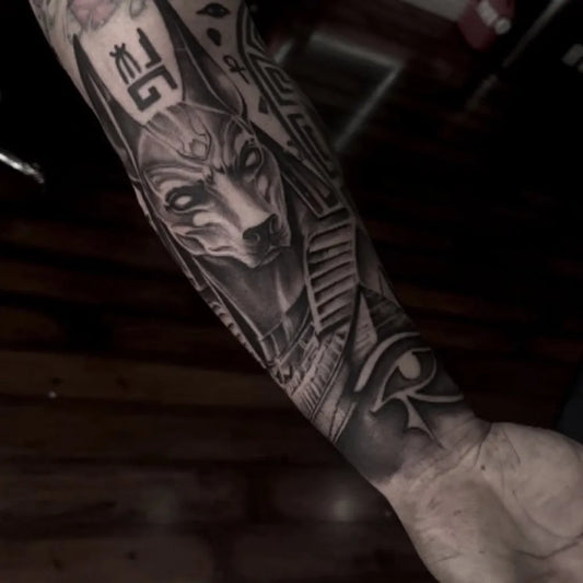 Big Black and Grey Anubis Eye of Horus Tattoo on Men Arm by @franko_inks