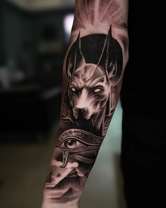 Big Black and Grey Anubis Eye of Horus Tattoo on Men Arm by @inkskinpro