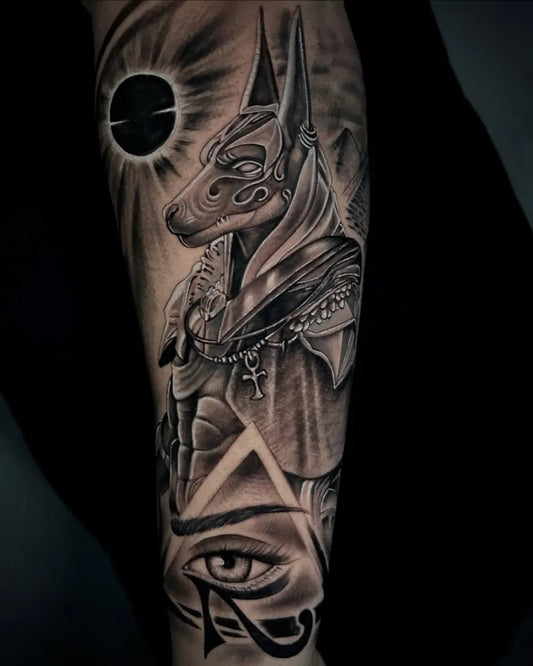 Big Black and Grey Anubis Eye of Horus Tattoo on Men Arm by @roquetattooink