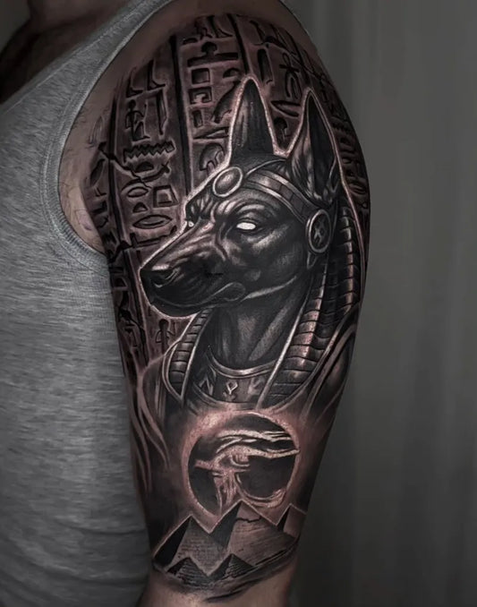 Big Black and Grey Anubis Hieroglyphs Pyramid Tattoo on Men Arm by @vondetattoo