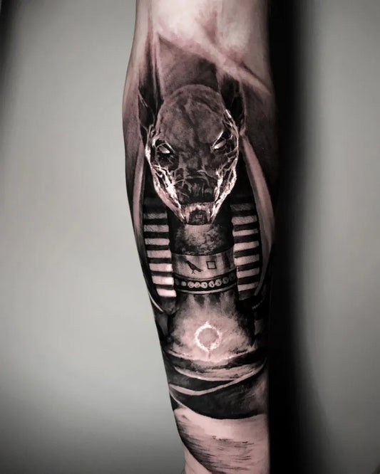 Big Black and Grey Anubis Jackal Tattoo on Men Arm by @george_papatsimpas