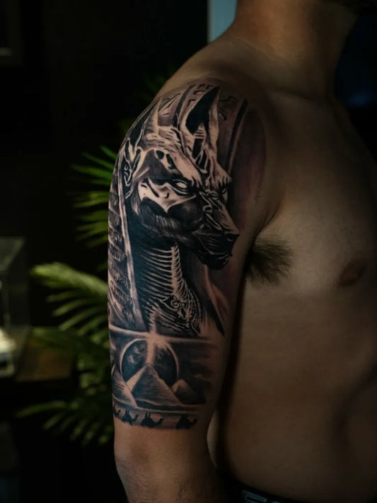 Big Black and Grey Anubis Jackal and Hieroglyphs Tattoo on Men Shoulder by @kiddo_tats