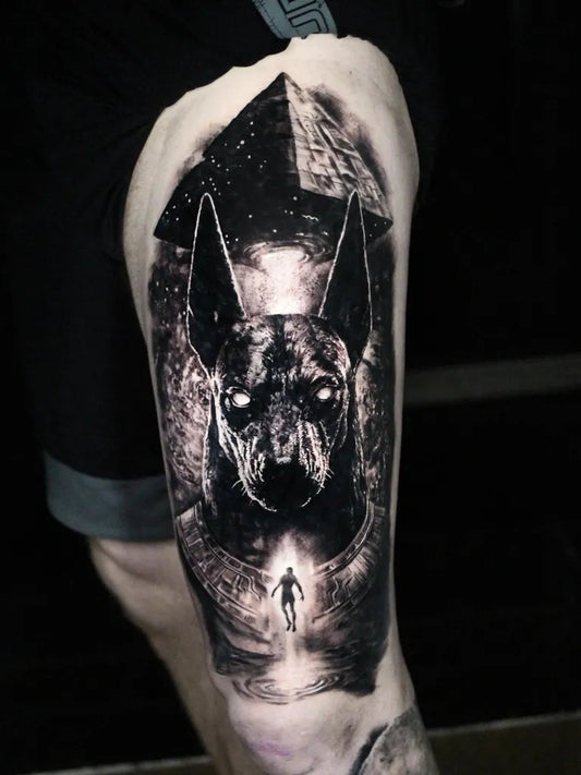 Big Black and Grey Anubis Pyramid Portal Tattoo on Men Thigh by @anthonyjenkins_et