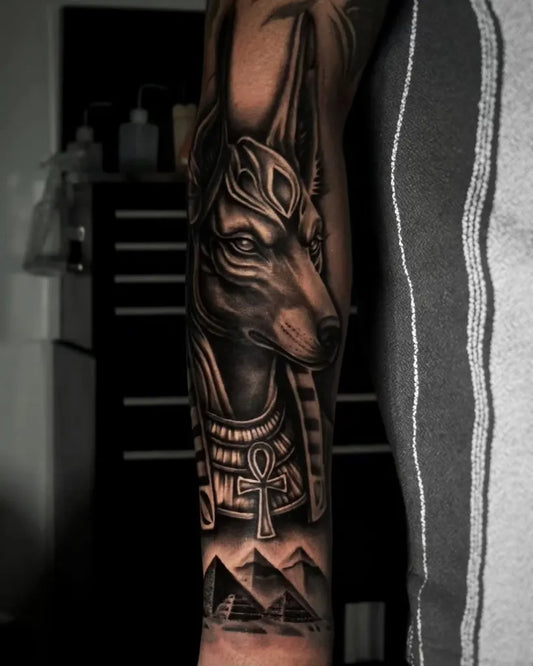 Big Black and Grey Anubis Pyramids Tattoo on Men Arm by @bre_inside.ink