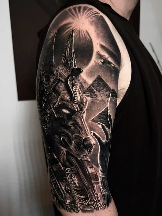 Big Black and Grey Anubis Pyramids Tattoo on Men Arm by @k.richard.art