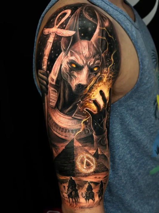 Big Black and Grey Anubis Pyramids Tattoo on Men Arm by @stlouis_art